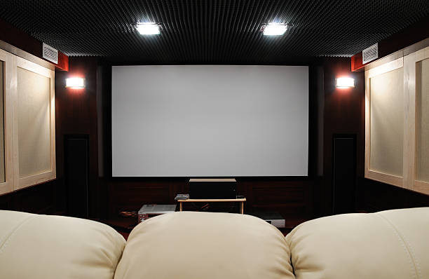 Behind the couch point of view of home theater setting soundproof home theater in home cellar with clean canvas for any contents subwoofer photos stock pictures, royalty-free photos & images