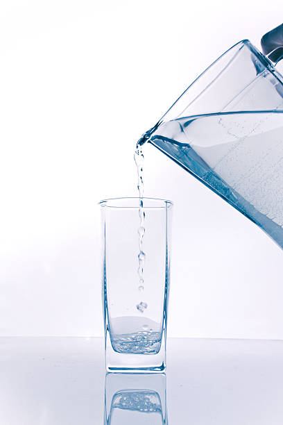 istock water being poured into a glass 179253010