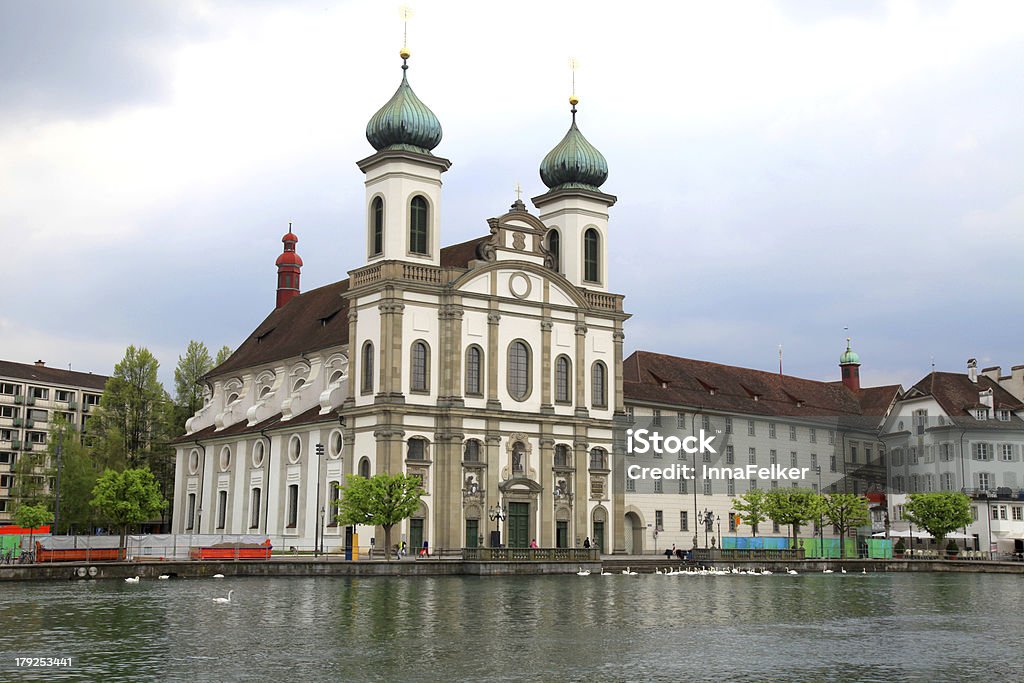 Jesuit Church and waterfront , Lucerne, Switzerland Jesuit Church and buildings on waterfront of Reuss River, Lucerne, Switzerland Architecture Stock Photo