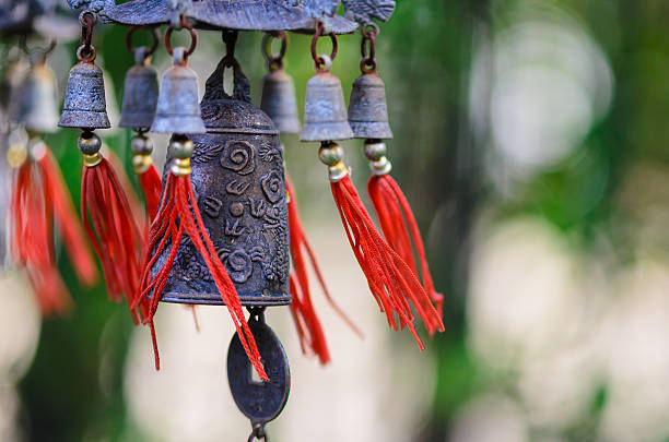 istock Chinese bell and coin with red strings being blown outdoors 179253654
