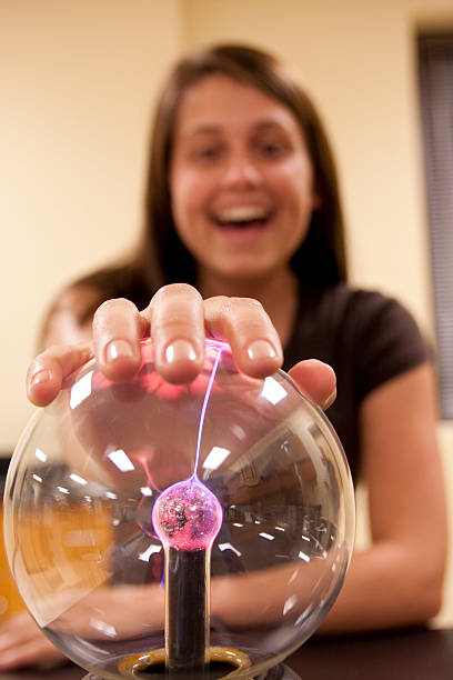 istock Female student touching a plasma ball. 179254119