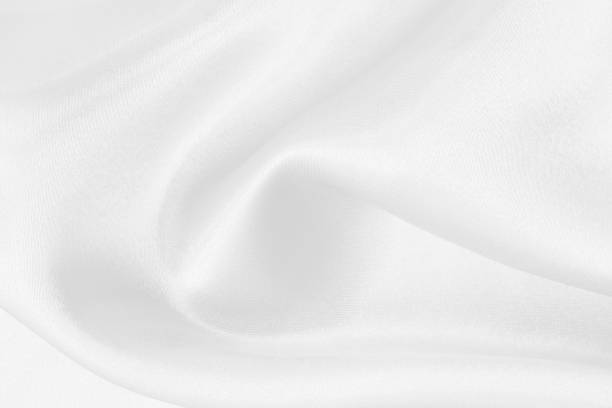 istock White fabric texture for background and design, beautiful pattern of silk or linen. 1792550910
