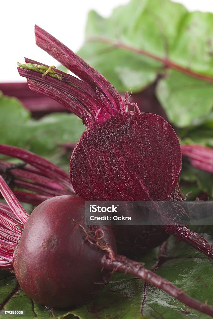 Beet Fresh beets on leafs close up. White background. Not isolated. Beet Stock Photo