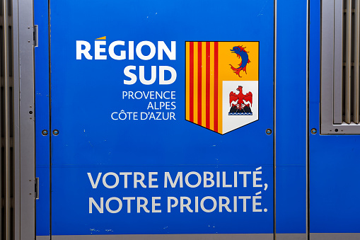 Close-up of coat of arms of dark blue regional train at railway station of French City of Toulon. Photo taken June 9th, 2023, Toulon, France.