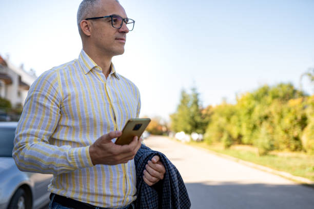 istock Checking my phone in front of the building 1792571729