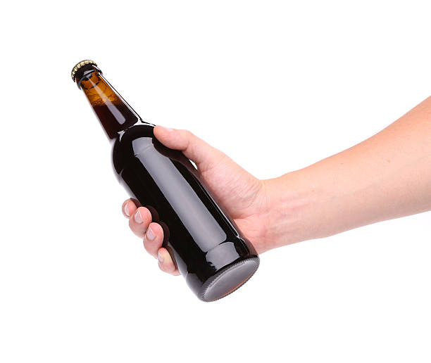 istock bottle of beer in a hand 179257674