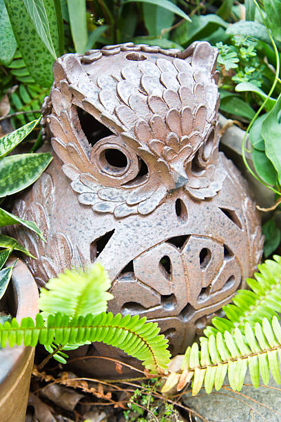 istock owl pot  in the green plants 179258073