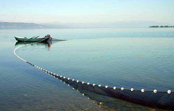 A fishing boat with its nets cast out