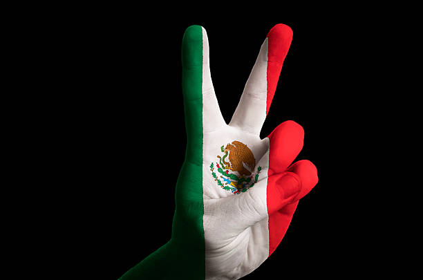 istock mexico national flag two finger up gesture for victory 179258368