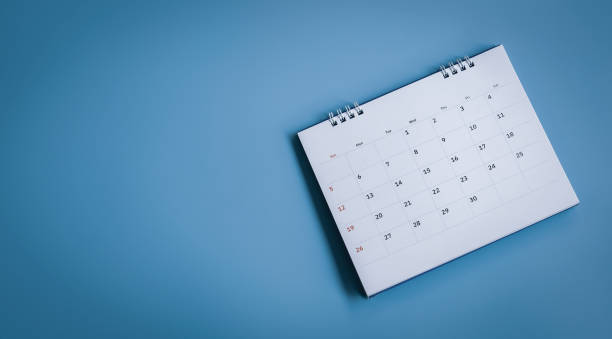 istock White calendar on a blue background 1792589597