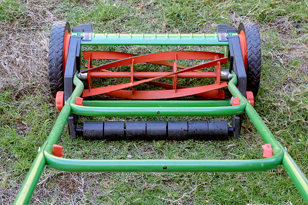 istock Rotary or reel lawnmower as seen from the operator's perspective. 179259176