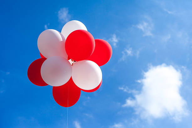 Cluster of Balloons Floating in Sky stock photo