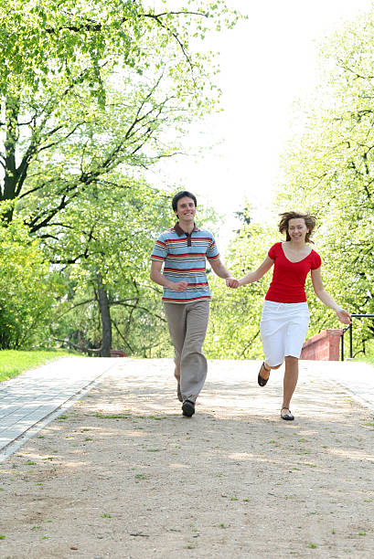 istock Couple Running in a Park 179259624
