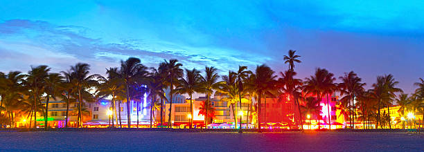 Miami Beach, Florida  hotels and restaurants at sunset "Miami Beach, Florida panorama of hotels and restaurants at sunset on Ocean Drive, world famous destination for it's nightlife, beautiful weather and pristine beaches" south beach photos stock pictures, royalty-free photos & images