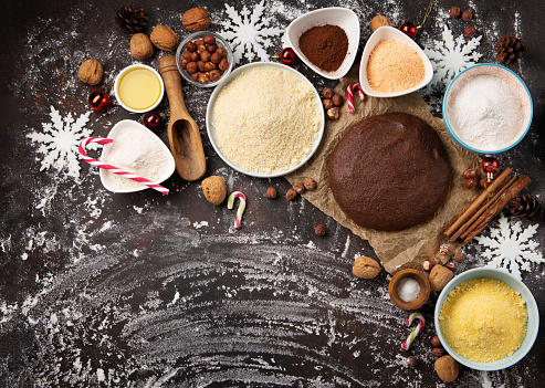 Gluten Free Homemade Christmas Cookie Dough. Healthy eating, dieting, balanced food concept. Cereals gluten-free, millet, quinoa, almond, buckwheat, spices, honey on brown background. Ancient grain food.