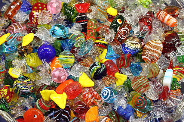 Venetian Murano glass sweets Venetian Murano glass sweets sold in a shop murano stock pictures, royalty-free photos & images