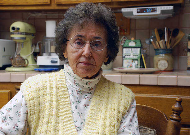 Senior woman showing age, beauty, grace and wisdom. Soft focus. Kodachrome scanned film with grain.
