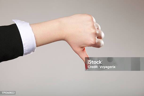 Female Hand Signaling Thumb Down Stock Photo - Download Image Now - Adult, Agreement, Attitude
