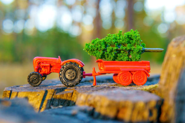 istock Toy Tractor with Miniature Green Tree in the Bed 1792609345