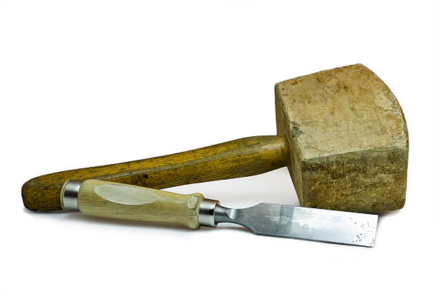 wooden hammer and chisel used wooden hammer and chisel on white background. These work tools are used by the cabinetmaker. chisel stock pictures, royalty-free photos & images