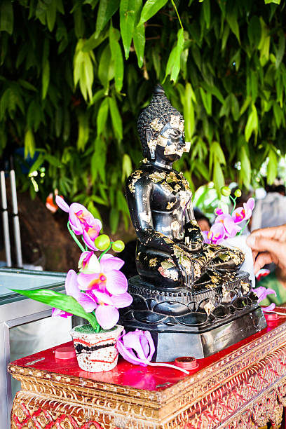 istock Buddhist covering buddha image with gold leafs 179263041