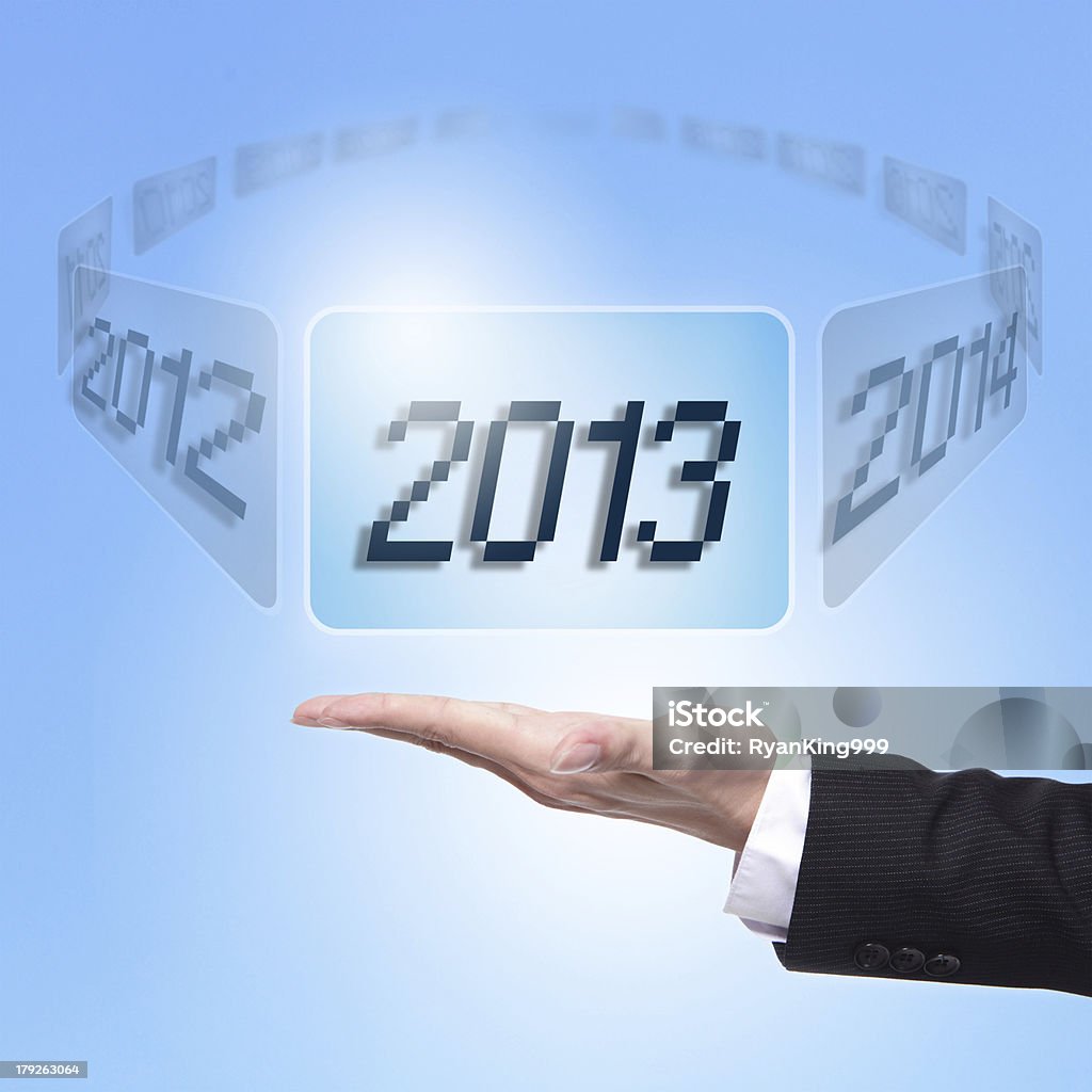 Business man holding screen with 2013 "hand of Business man holding screen button with 2013 number, happy new year 2013 in business conceptModel:" 2012 Stock Photo