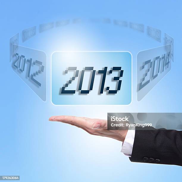 Business Man Holding Screen With 2013 Stock Photo - Download Image Now - 2012, 2013, 2014