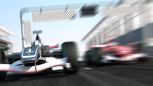 Blurry, speeding formula 1 car race Car Formula 1 car with zoom focus. auto racing photos stock pictures, royalty-free photos & images