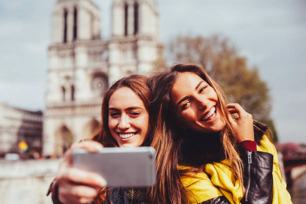 Friends in Paris taking selfie stock photo