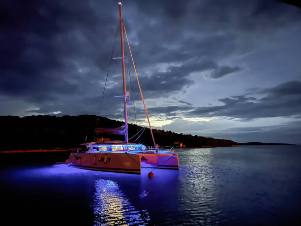 istock Anchored catamaran at dusk 1792648083