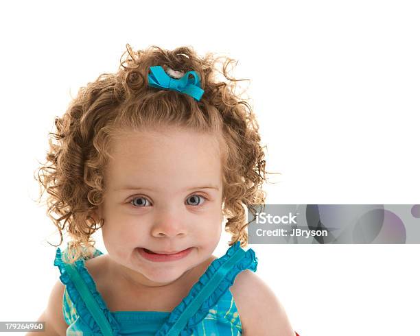 One Year Old Baby Girl With Blue Eyes Curly Hair Stock Photo - Download Image Now - Hair Bow, 12-17 Months, 12-23 Months