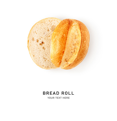 Fresh wheat bread roll bun halved isolated on white background. Healthy eating and food concept. Flat lay, top view. Creative layout