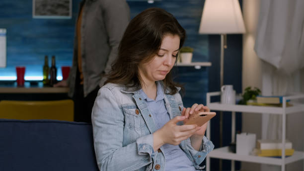 istock Cheerful woman browsing on social media using smartphone 1792654000
