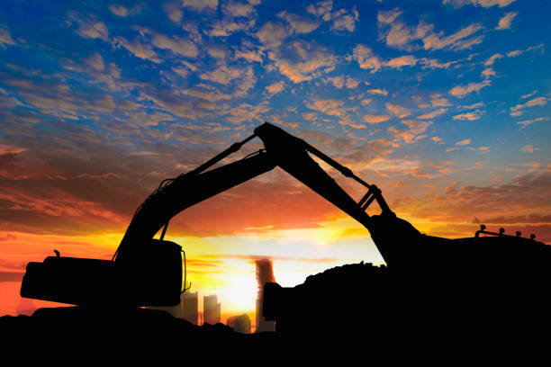 istock Crawler excavators silhouette are digging the soil in the construction site. 1792667442
