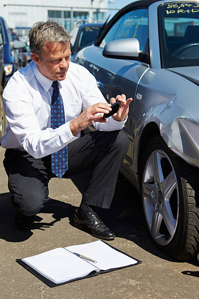 istock Loss Adjuster Inspecting Car Involved In Accident 179266757
