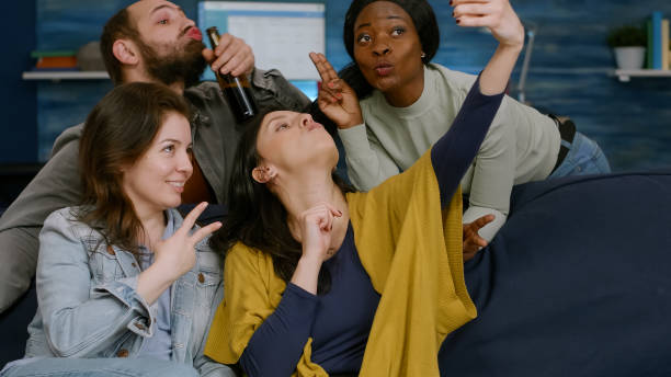 istock Multiracial friends taking sefie together using smartphone posting on social media 1792671320