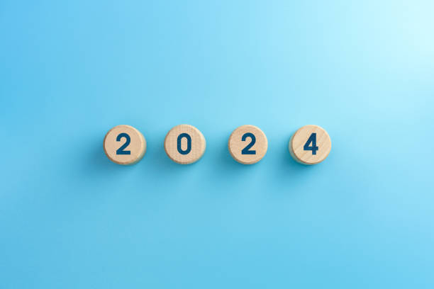 istock Wooden blocks with 2024 icon on blue background 1792671357