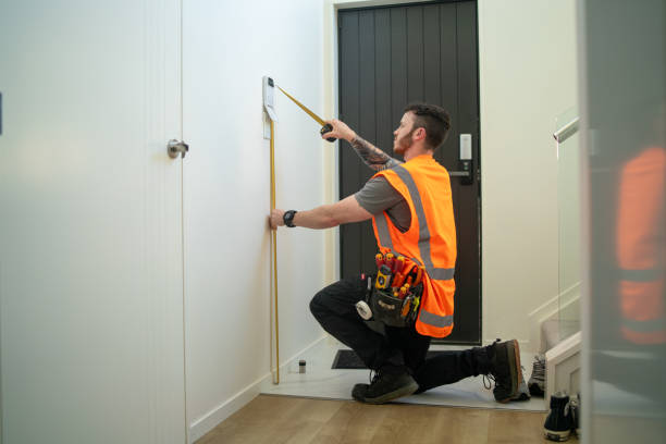 istock Male Electrician Using Tape Measure 1792674119