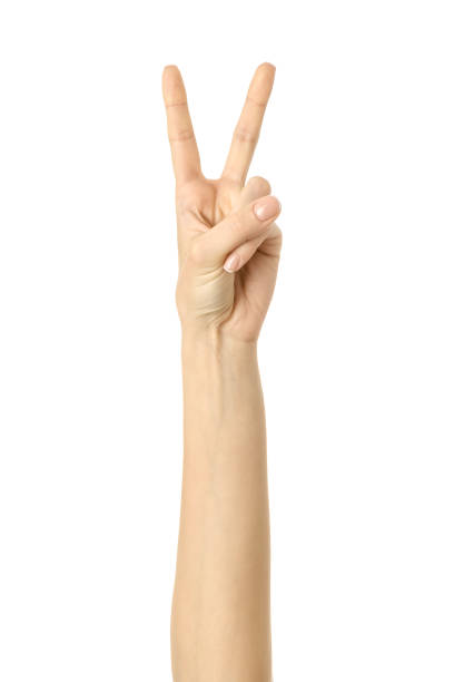 istock Victory sign. Woman hand gesturing isolated on white 1792681448