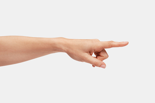 Close up woman hand touching or pointing to something isolated on white background with clipping path.