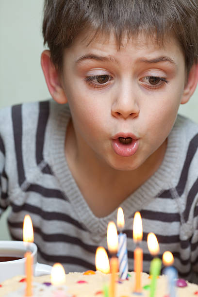istock Cute boy at birthday cake 179268372