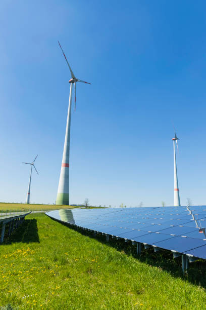istock modern solar panels and wind turbines in a rural landscape 1792683733