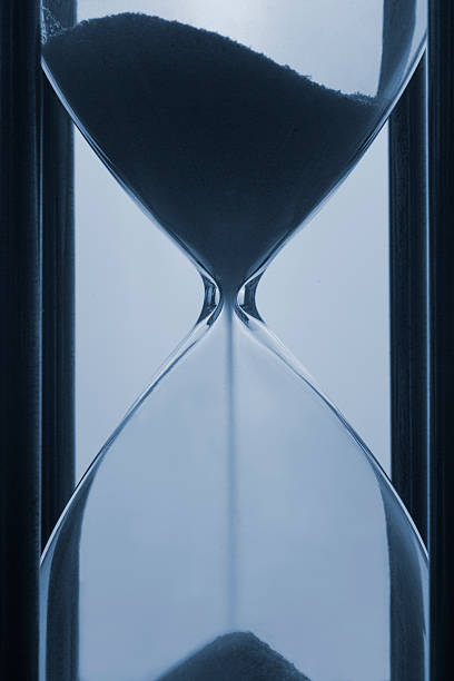 istock Hourglass Macro Blue Sand Timer Sands of Time 179268583