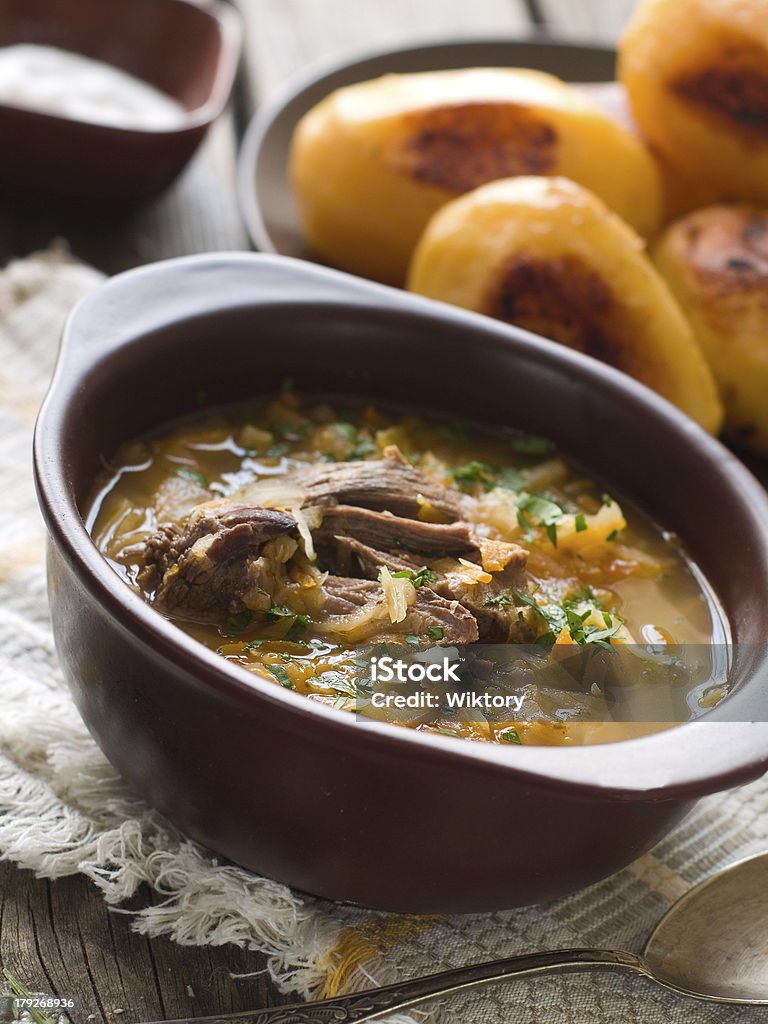 vegetable soup A bowl of vegetable soup with sour cabbage, selective focus Animal Stock Photo