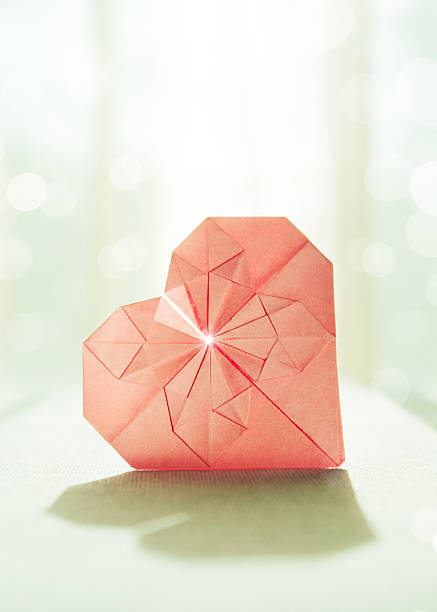 Stylized image of a paper origami heart stock photo