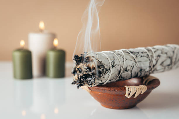 istock White sage and burning candles in background 1792702545