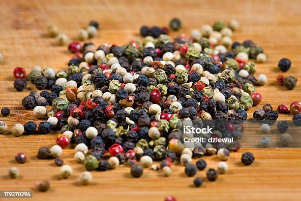 Peppercorns On A Wooden Board Stock Photo - Download Image Now - Agriculture, Close-up, Condiment