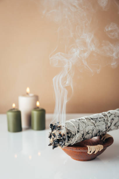 istock White sage and burning candles in background 1792703629