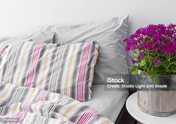 Bedroom Decorated With Bright Purple Flowers Stock Photo - Download Image Now - Apartment, Bed - Furniture, Bedding