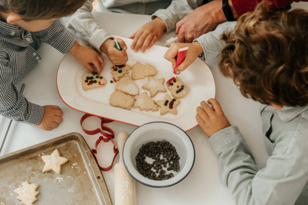 istock Boys decorating Christmas cookies 1792723972